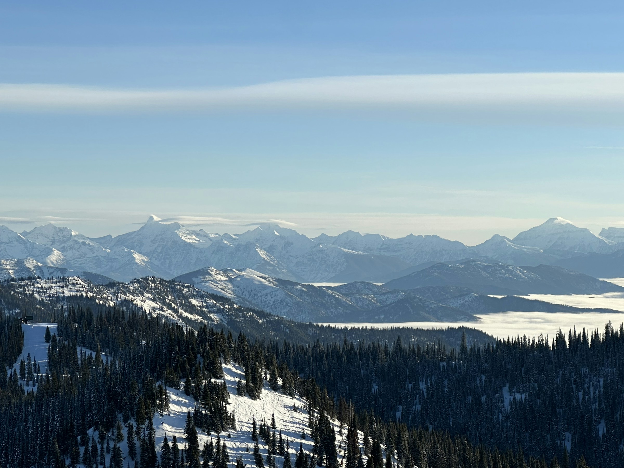 Snow-covered mountain ranges seen from Whitefish Mountain Resort